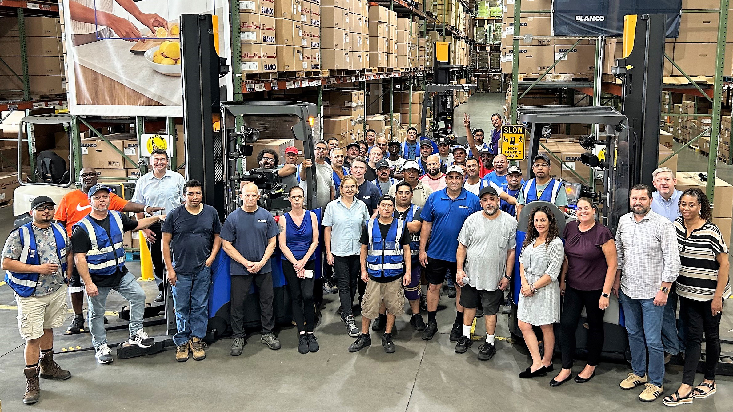 BLANCO employees celebrate BLANCO America’s 35th anniversary at the Lumberton, NJ warehouse in 2023.