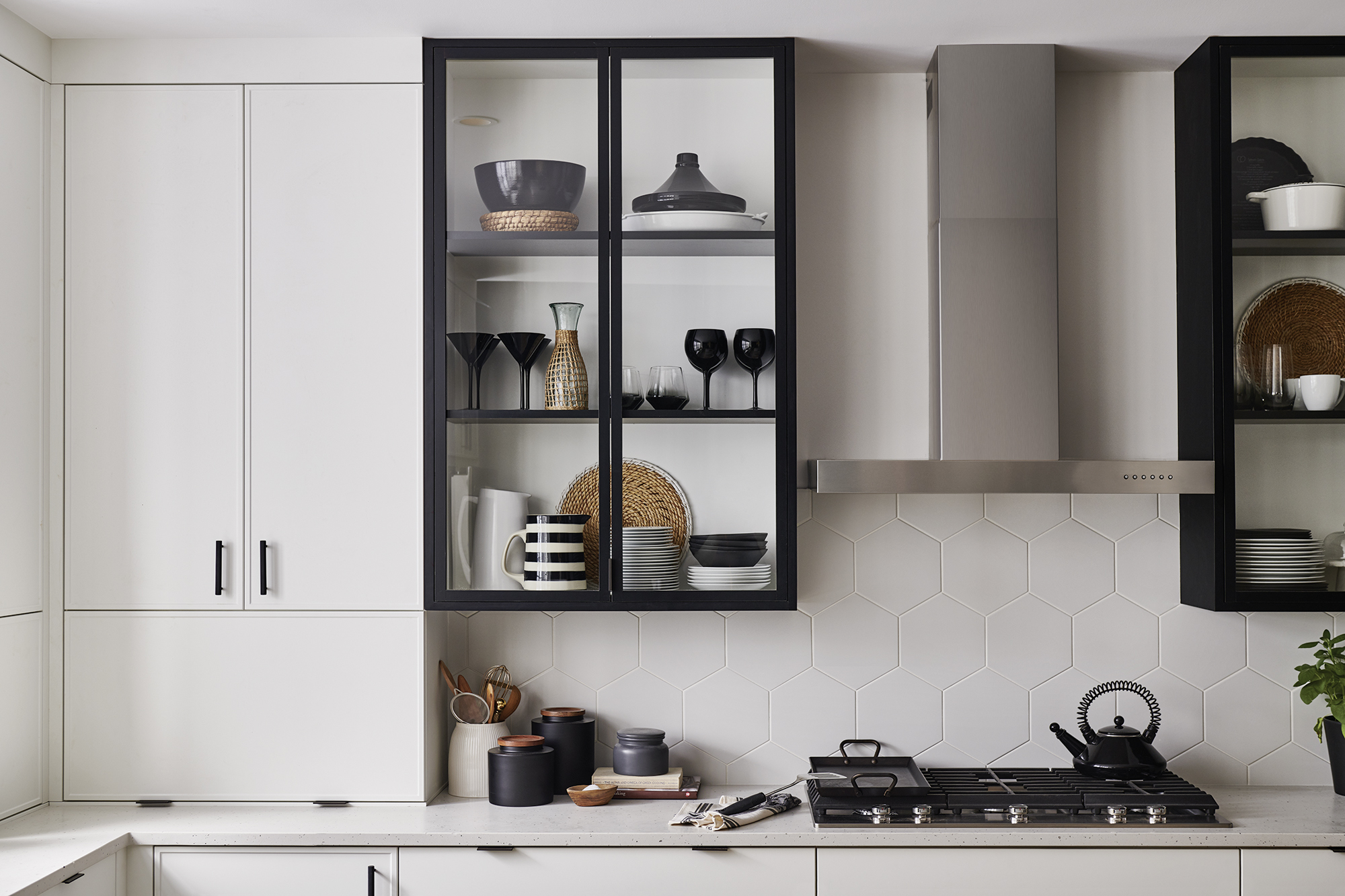 Incorporate white wall shelving along with a white subway tile backsplash.
