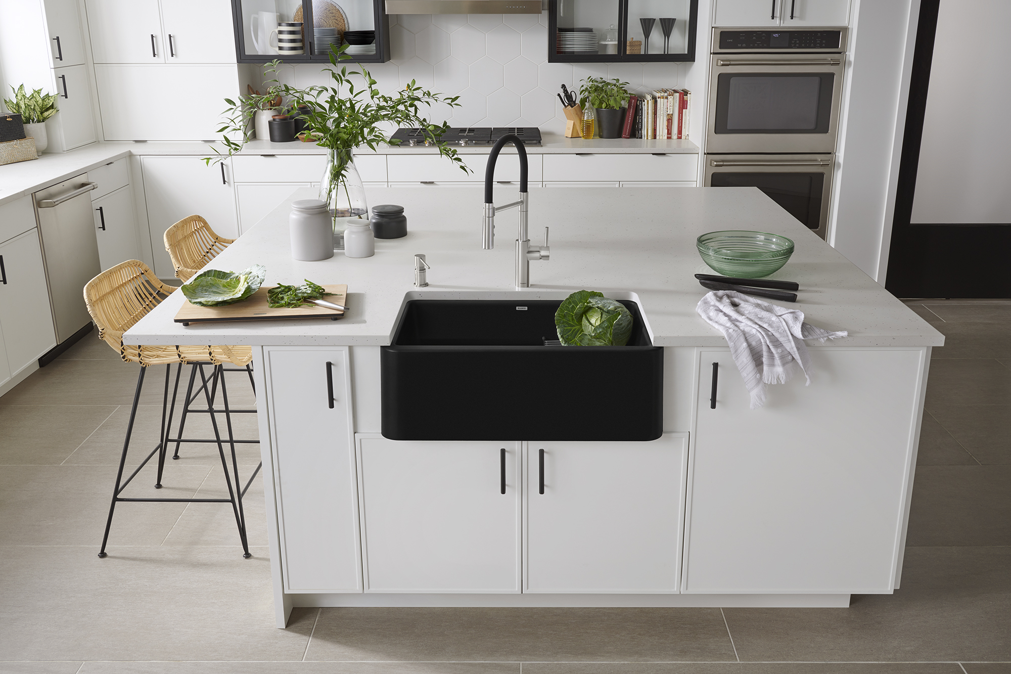 An added feature of modern white kitchen cabinets is that they make the hardware stand out.