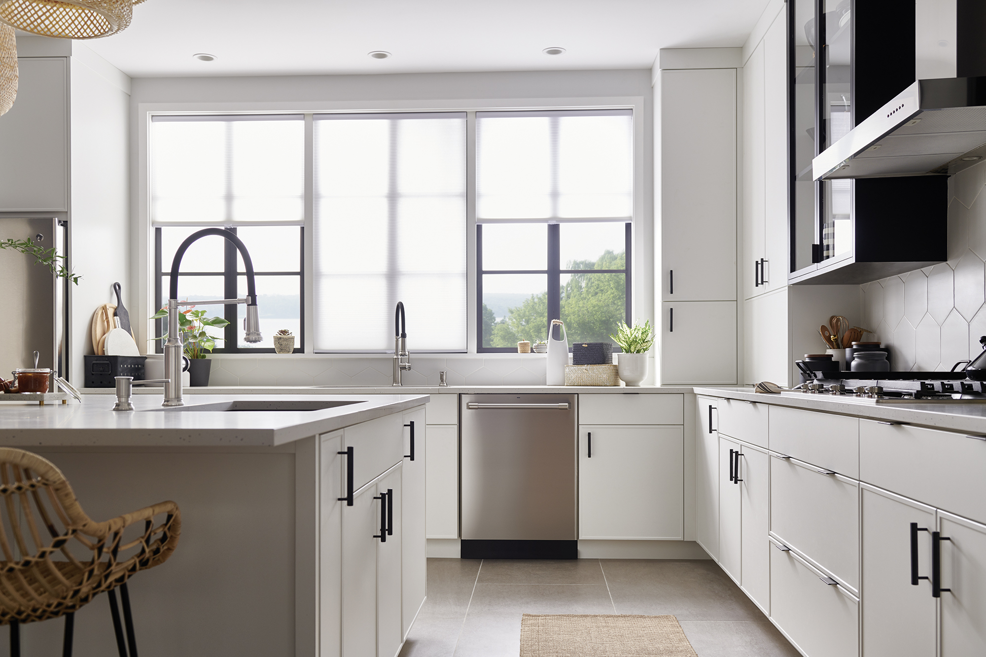 Flooring is a chance to add balance to a modern white kitchen through unique patterns