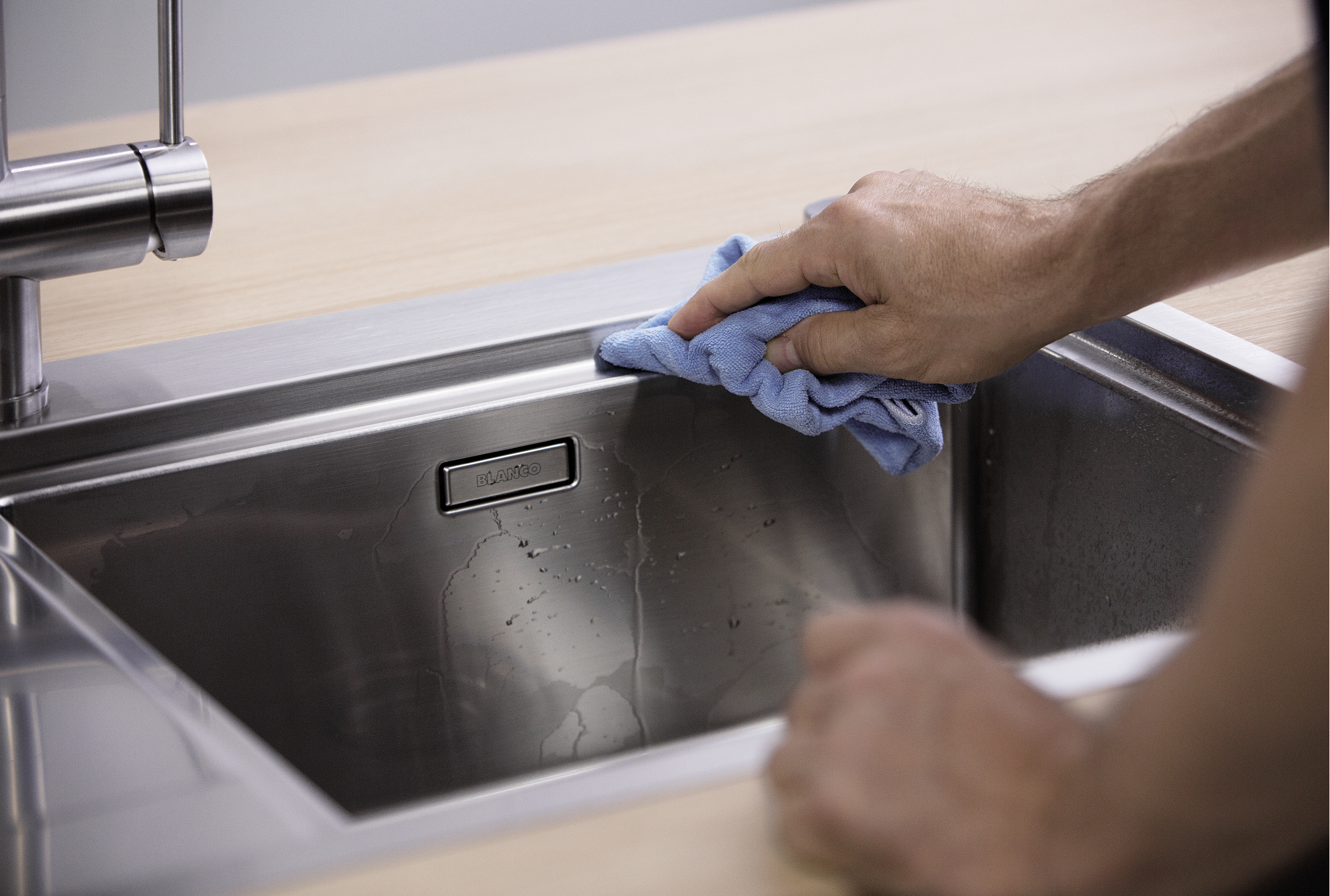 BLANCO sink is rubbed dry with a microfibre cloth