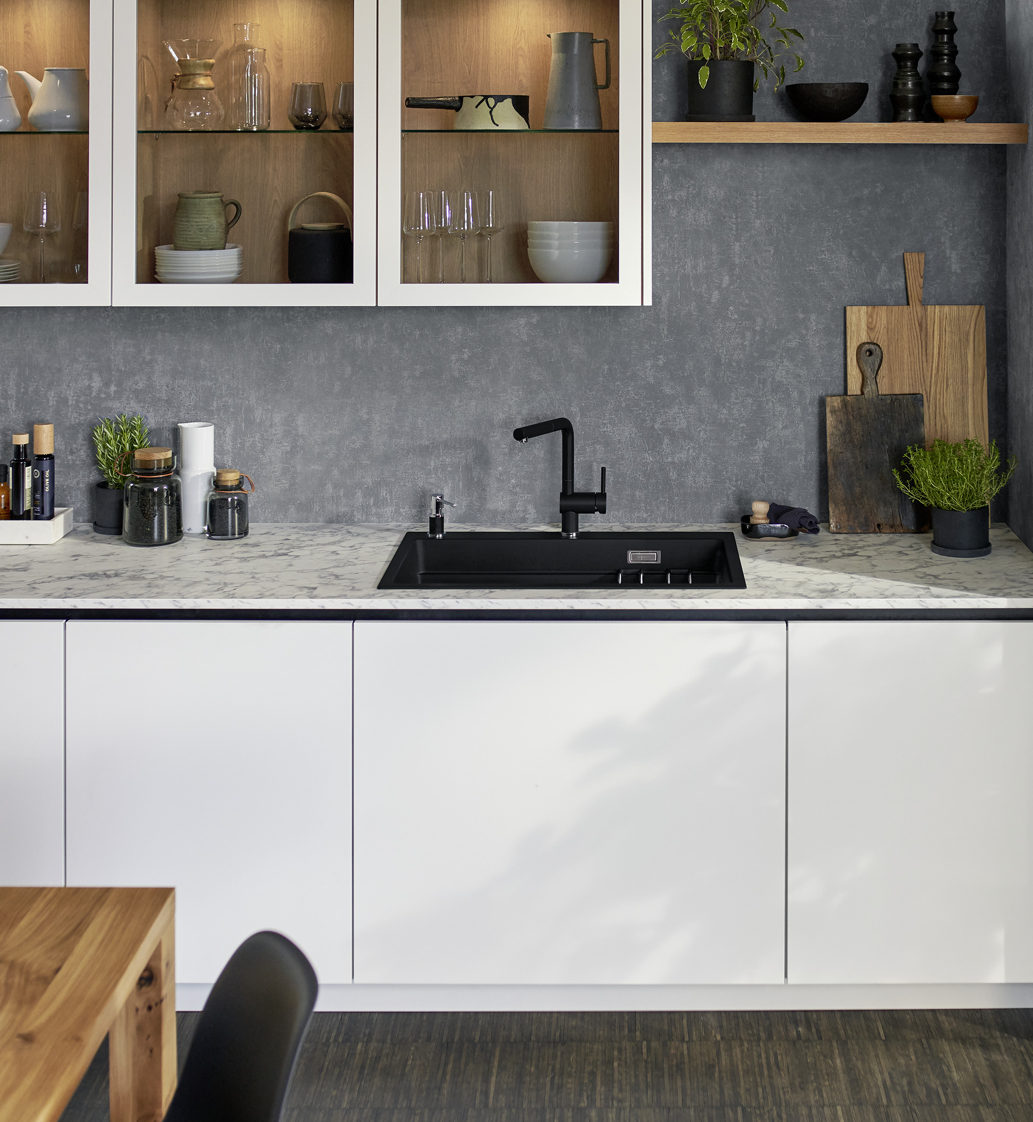 a beautiful kitchen with a vintera sink in silgranite