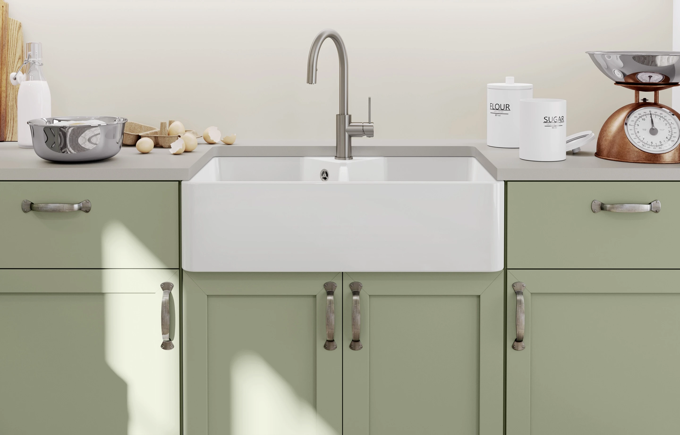The apron front of a traditional farmhouse-style sink protrudes from the kitchen units.