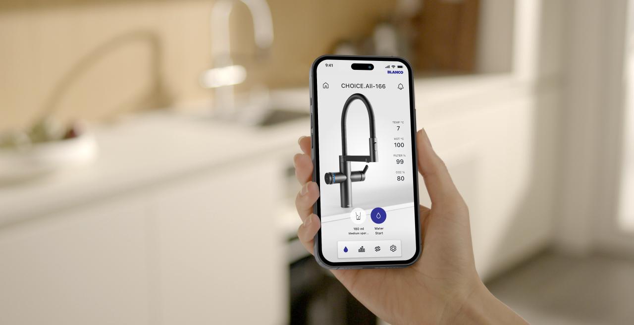 Hand holding phone where UNIT App is displayed