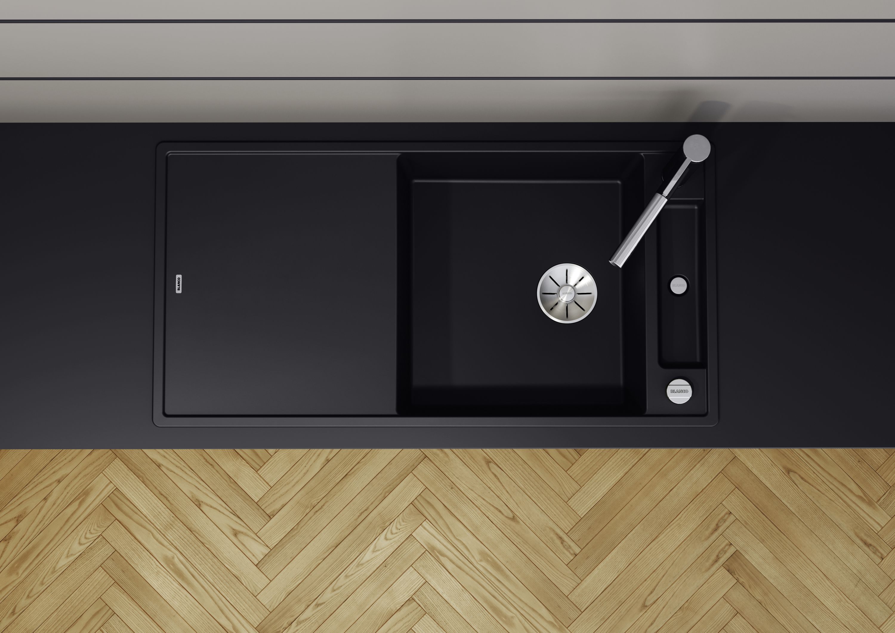 Mixer taps and sinks in the new SILGRANIT® PuraDur® black nestle perfectly into dark worktops.